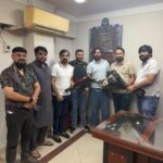 Members presenting bouquets during a congratulatory visit for PSGMEA Vice Chairman Ahmed Imtiaz Khan.